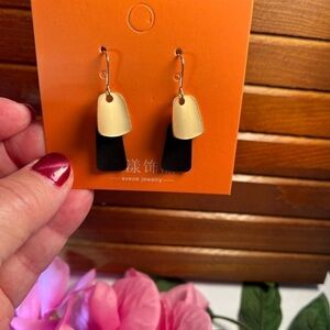 Fashion jewelry pierced drop earrings, black and gold dangles.